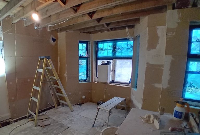 Internal wall insulation boards fitted in a bay window room